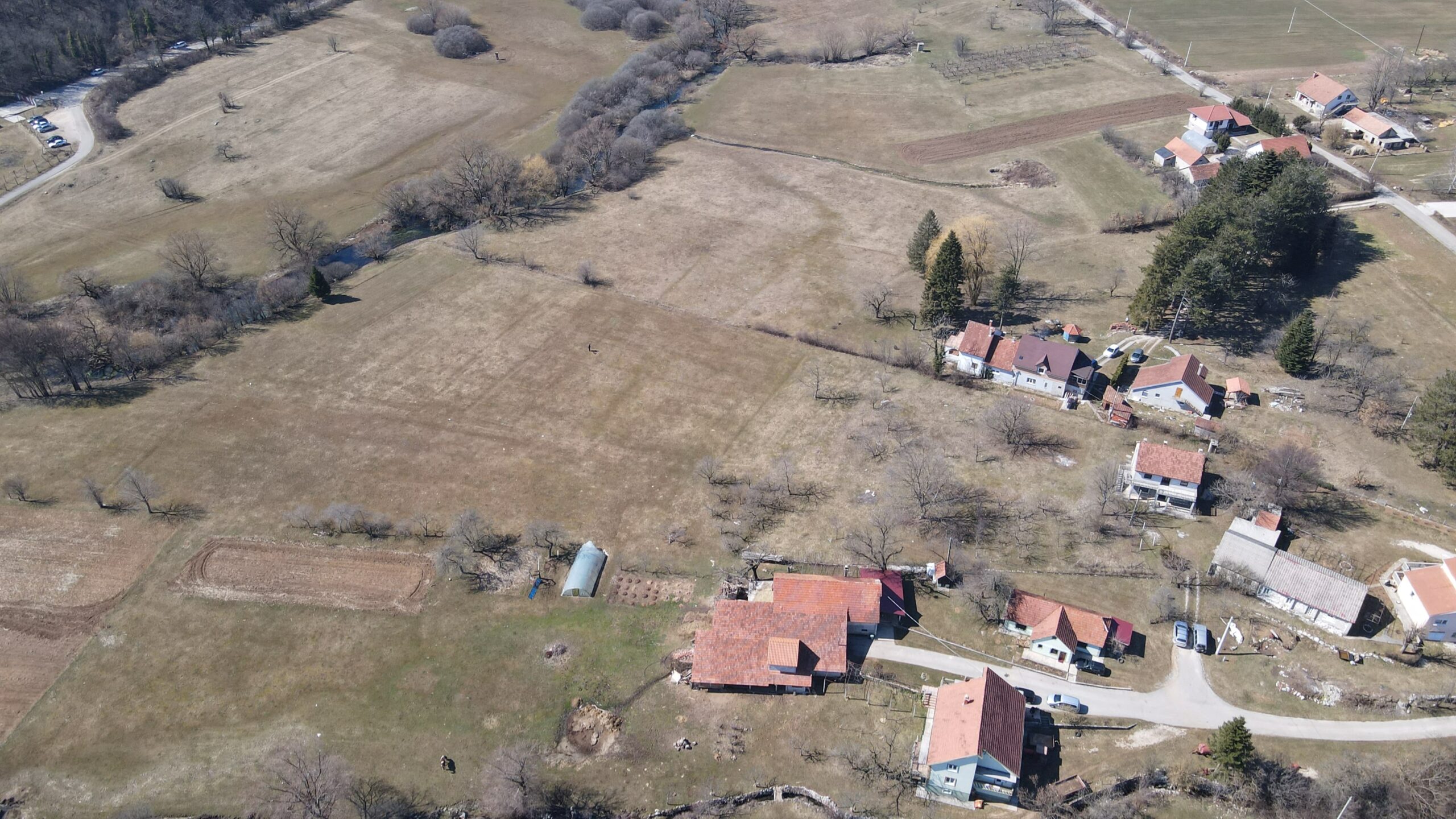 Farmland with architectural plans and river access