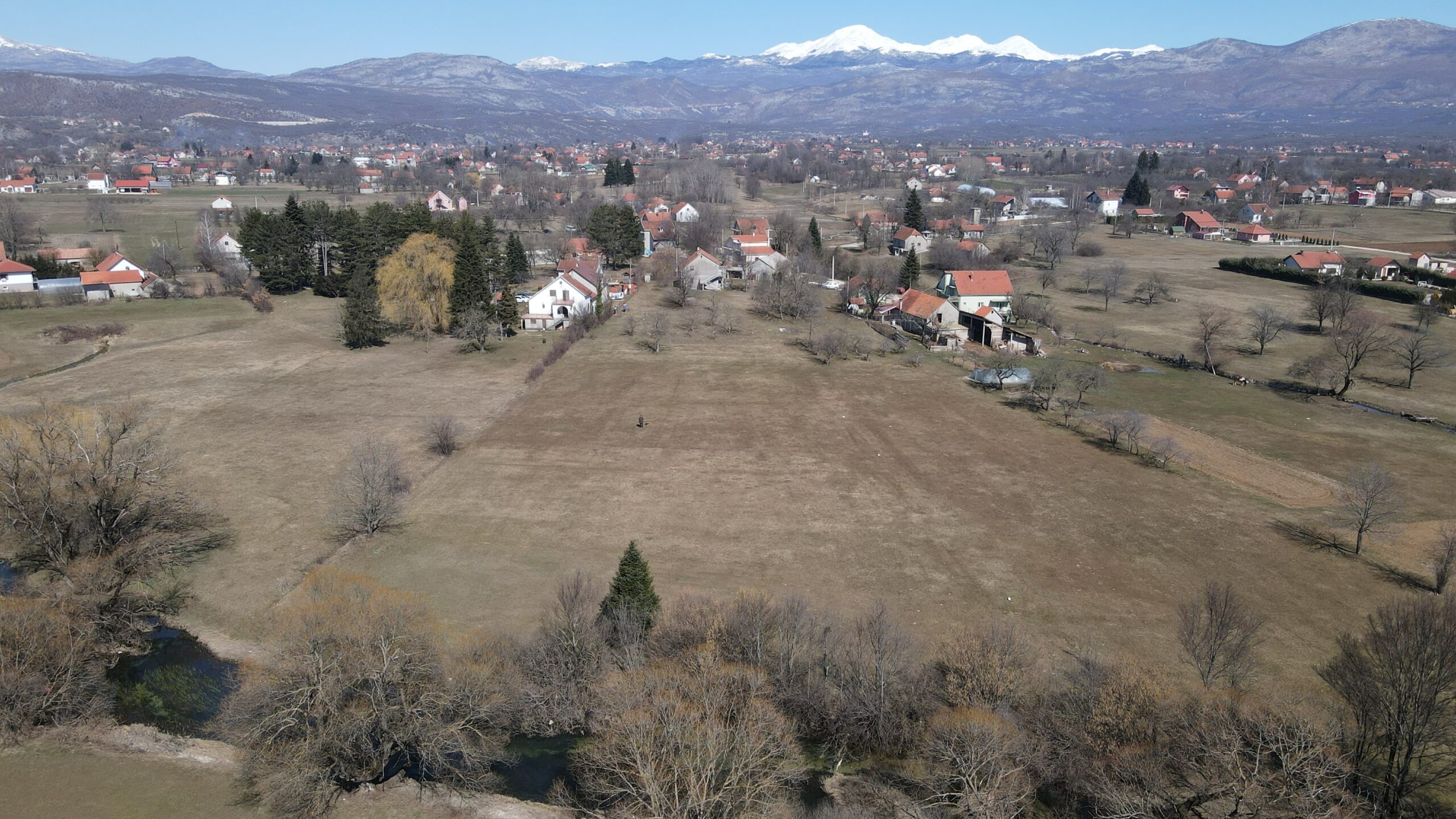 Farmland with architectural plans and river access
