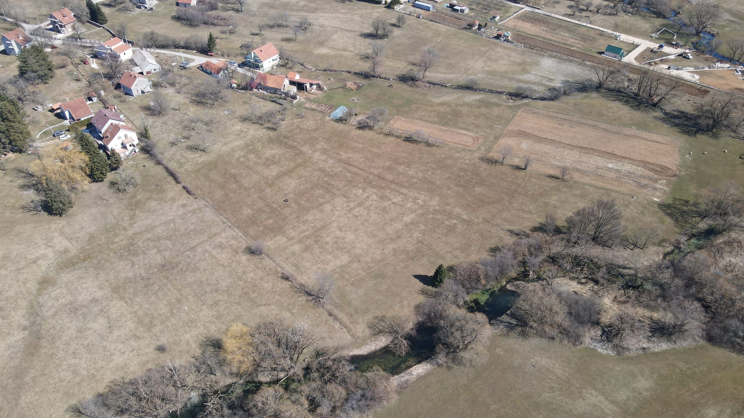 Farmland with architectural plans and river access